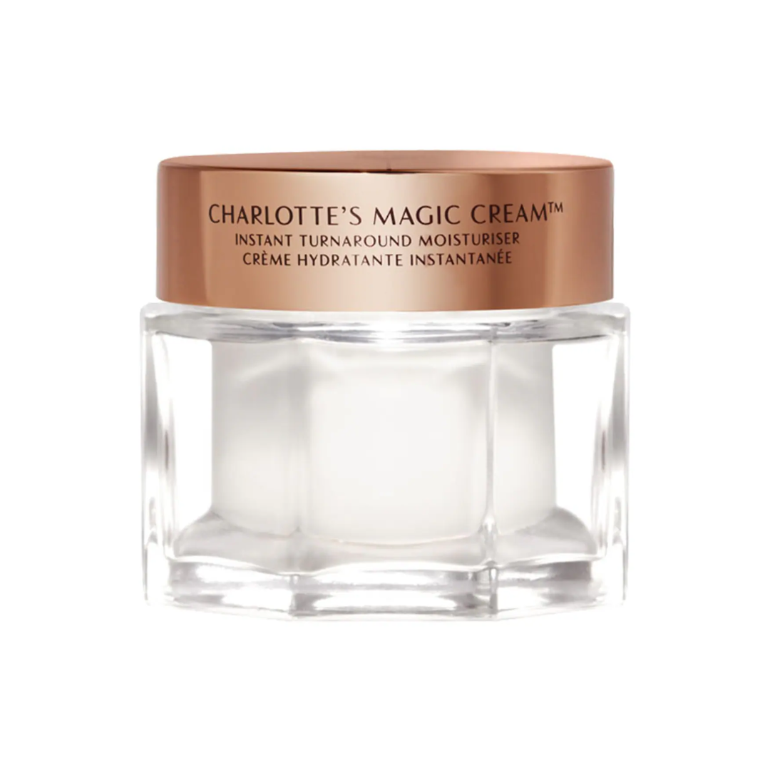 Jar of Charlotte's Magic Cream with a bronze lid on a white background