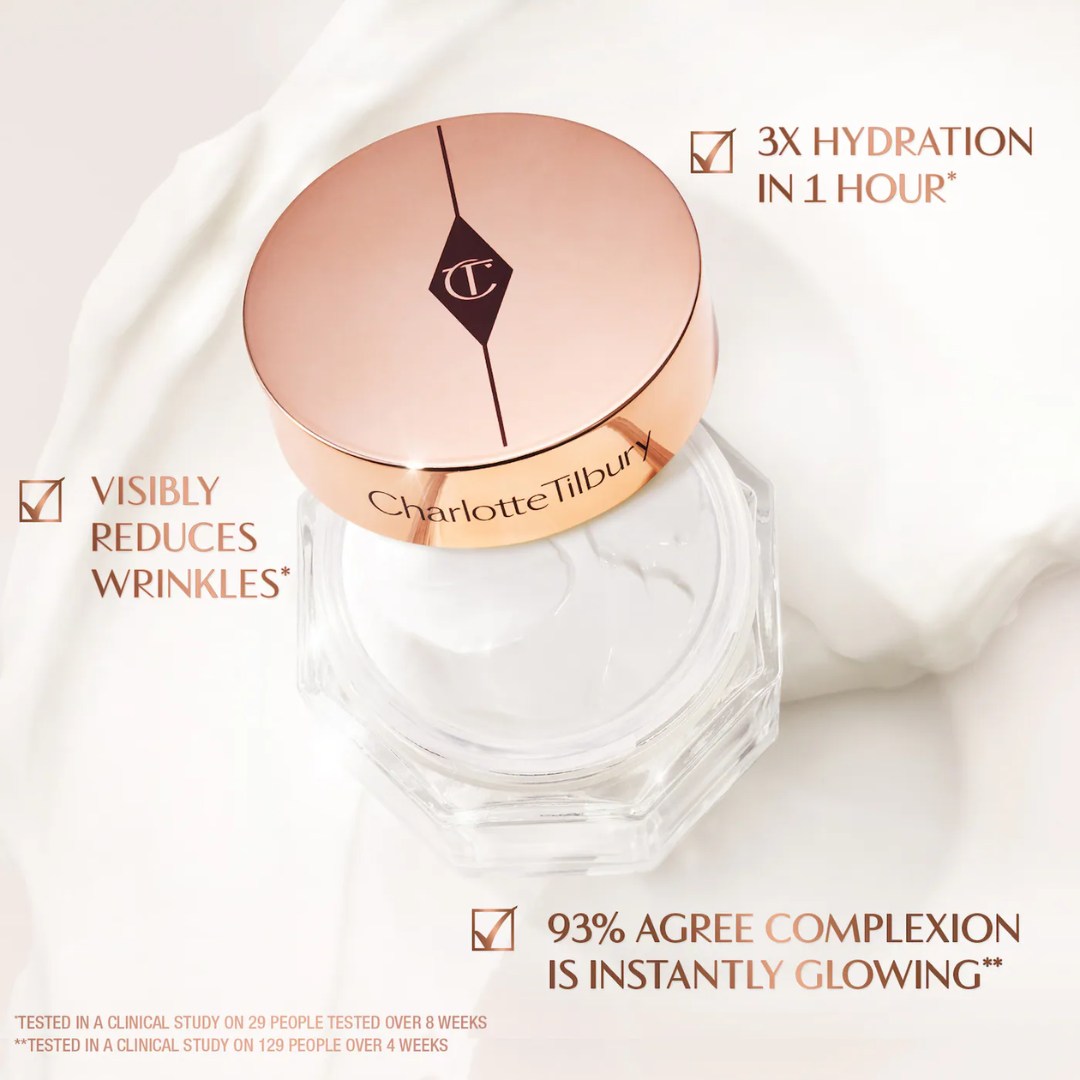 Jar of Charlotte's Magic Cream with a bronze lid on a white background