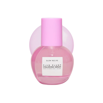 Pink serum bottle with a white label on a white background