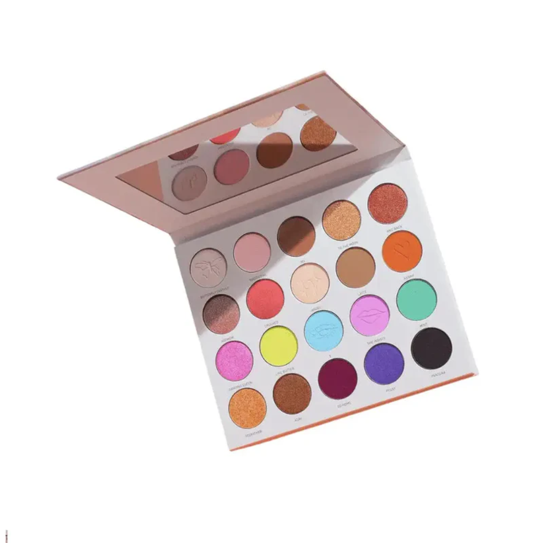 Makeup palette with a variety of colors on a white background