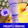 NYX Professional Makeup lip balm with a pineapple smoothie in the background